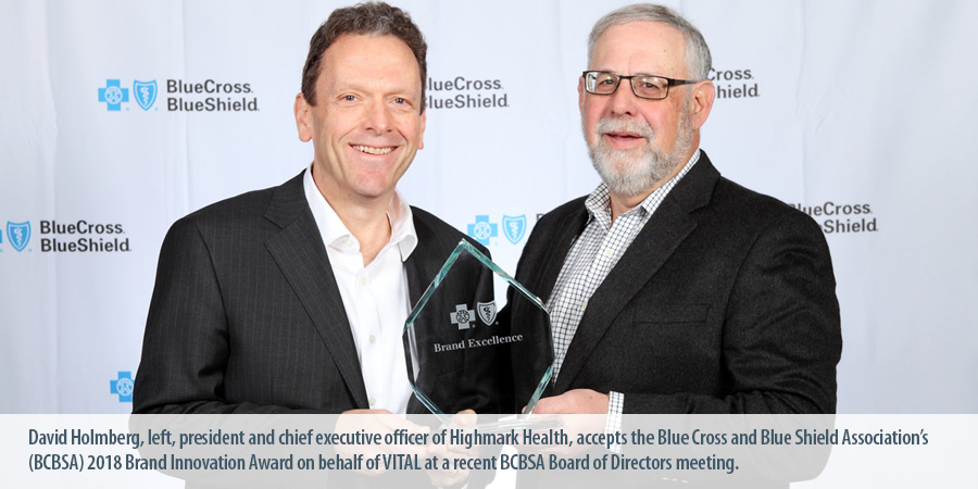 David Holmberg, left, president and chief executive officer of Highmark Health, accepts the Blue Cross and Blue Shield Association's (BCBSA) 2018 Brand Innovation Award on behalf of VITAL at a recent BCBSA Board of Directors meeting.